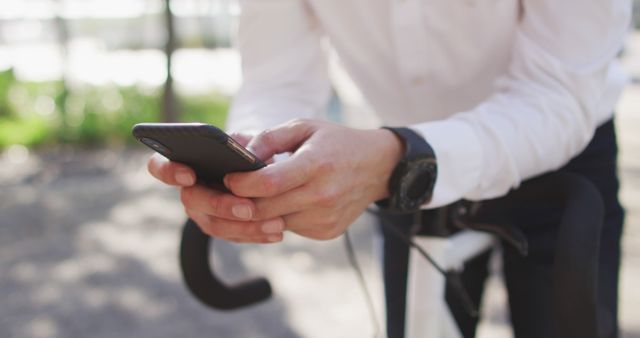 Businessman using smartphone while riding bicycle - Download Free Stock Images Pikwizard.com