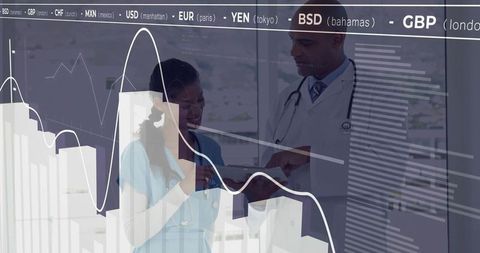 Hospital Professionals Analyzing Data on Digital Tablet