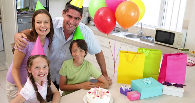 Happy Family Celebrating Child's Birthday with Gifts and Cake - Download Free Stock Images Pikwizard.com