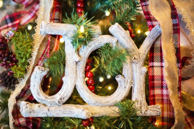 Joy Christmas Ornament with Festive Decorations on Christmas Tree - Download Free Stock Photos Pikwizard.com