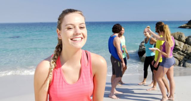 Cheerful Young Woman Enjoying Beach with Friends in Background - Download Free Stock Images Pikwizard.com