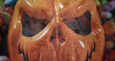 Halloween pumpkin mask with vibrant candy display