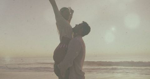 Romantic Couple Embracing at Scenic Ocean Sunset