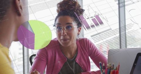 Businesswoman collaborating with digital chart overlay background