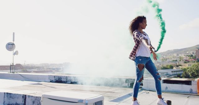 Joyful Woman Celebrating with Colorful Smoke on Rooftop - Download Free Stock Images Pikwizard.com