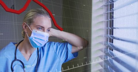 Contemplative Nurse Analyzing Medical Data by Window