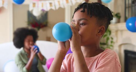 Family enjoying birthday celebration with colorful balloons