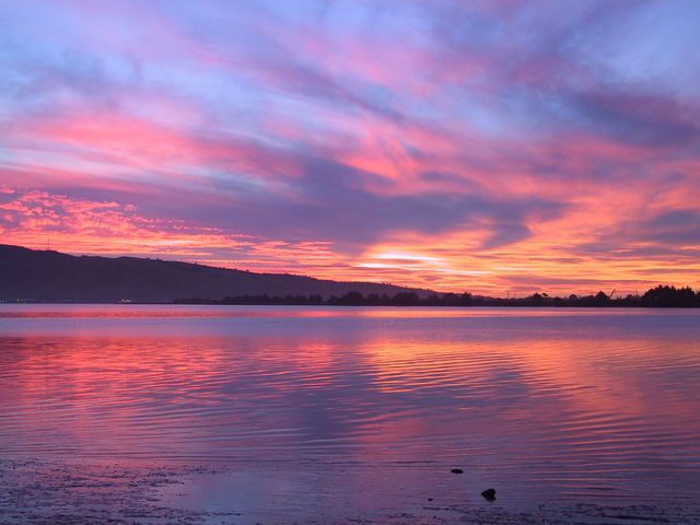 Vibrant Sunset Over Calm Lake with Colorful Sky - Download Free Stock Photos Pikwizard.com