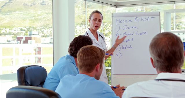 Medical professional giving presentation on medical report while colleagues listen attentively in a conference room. Suggests teamwork, professional collaboration, and healthcare planning. Ideal for illustrating hospital meetings, team discussions, and medical education scenarios.