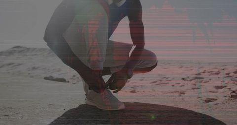 Runner Preparing for Desert Run with Shoelaces and Smartwatch