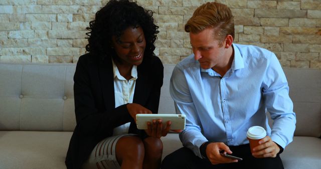 Colleagues Collaborating on Tablet Discussing Business Ideas - Download Free Stock Images Pikwizard.com