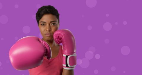 Confident Female Boxer Promoting Breast Cancer Awareness