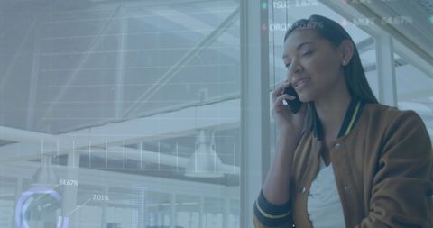 Businesswoman Analyzing Stock Market Data While on Phone