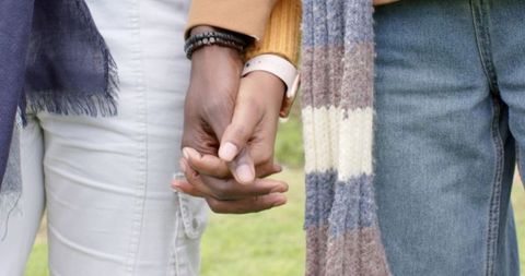 African american couple holding hands showing connection and affection outdoors