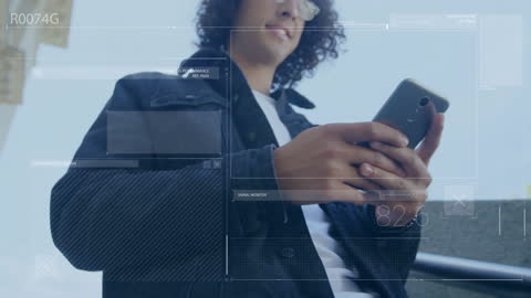 Futuristic Technology: Young Man Interacting with Data-Driven Interface