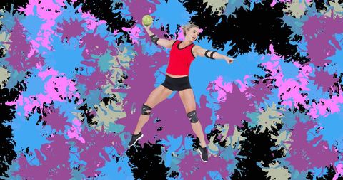 Dynamic Female Handball Player Mid-Jump with Vibrant Background