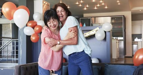 Senior Women Celebrating Birthday with Joyful Embrace