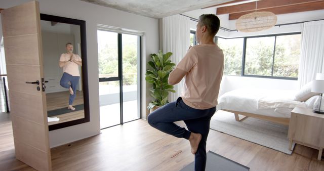 Man Practicing Yoga at Home in Bedroom with Full-Length Mirror - Download Free Stock Images Pikwizard.com