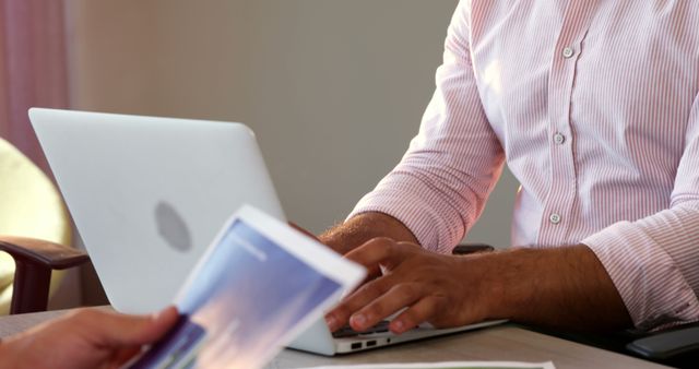 Man Using Laptop at Office Desk in Meeting - Download Free Stock Images Pikwizard.com