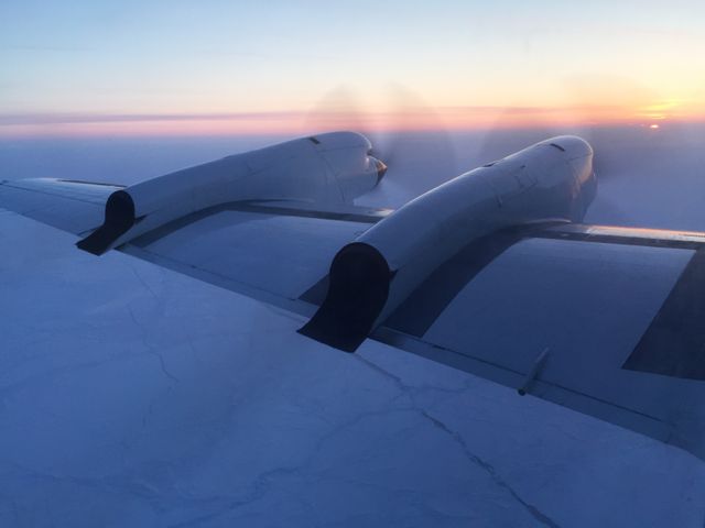 A stunning view from a NASA aircraft capturing polar ice at sunrise during Operation IceBridge mission. Perfect for illustrating climate research, flight science, polar exploration, and nature’s beauty in educational materials, documentaries, or climate change discussions.