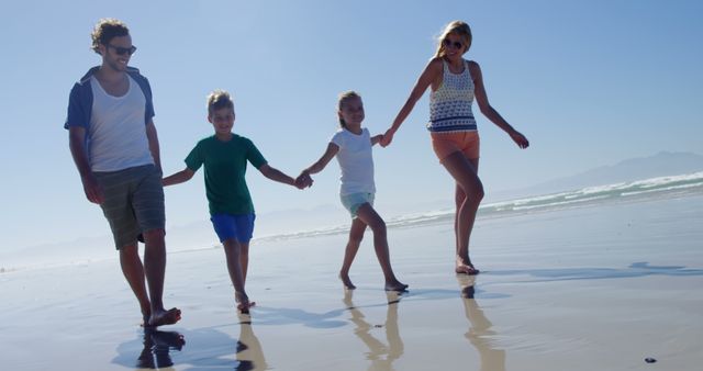 Happy Family of Four Enjoying a Day at the Beach - Download Free Stock Images Pikwizard.com