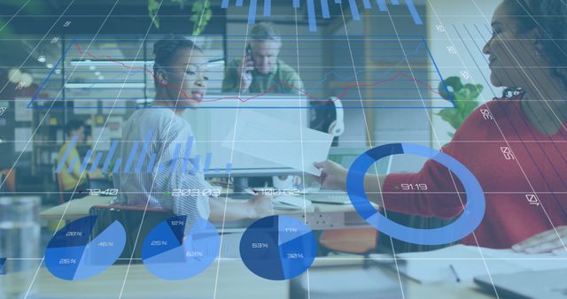 Diverse Colleagues Analyzing Business Statistics on Digital Diagrams in Office - Download Free Stock Images Pikwizard.com