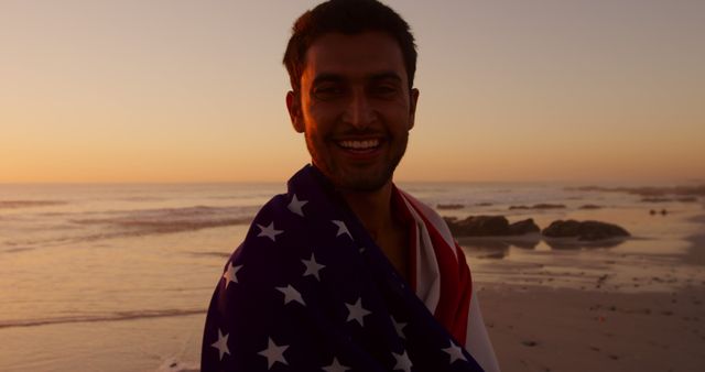 Smiling Man with American Flag at Beach during Sunset - Download Free Stock Images Pikwizard.com