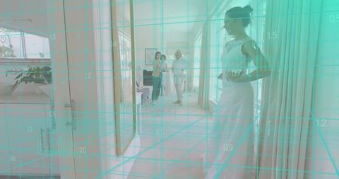 Posing bride wearing lace gown during boutique fitting with teal digital grid overlay