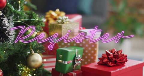 Festive christmas presents on tabletop with neon register sign and decorated evergreen