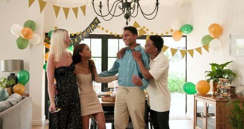 Happy Friends Celebrating Birthday at Festive Gathering