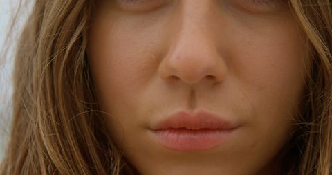 Close-Up of Caucasian Woman's Face with Subtle Smile at Beach - Download Free Stock Images Pikwizard.com