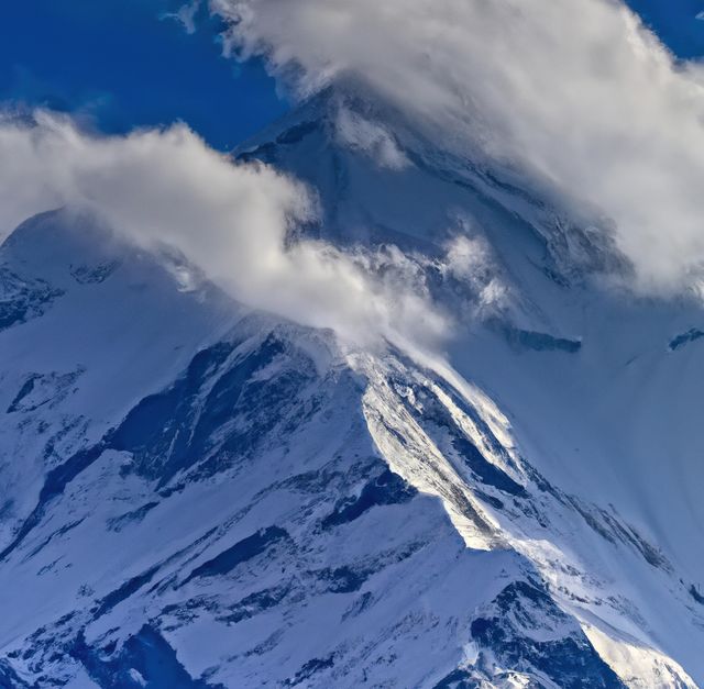 Image of rocky range of himalayas mountains with clouds and snowy peaks - Download Free Stock Photos Pikwizard.com