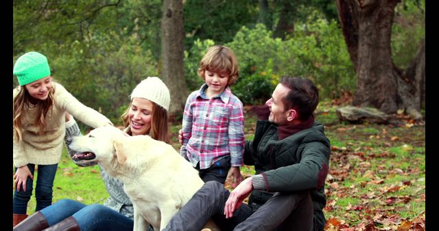 Happy Family Enjoying Time with Dog in Park - Download Free Stock Images Pikwizard.com