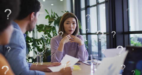 Diverse Thoughtful Business Meeting with Animated Question Marks