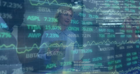 Colleagues Analyzing Data with Financial Stock Market Projection