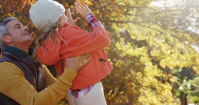 Father and Daughter Enjoying Fall in Sunny Park - Download Free Stock Images Pikwizard.com