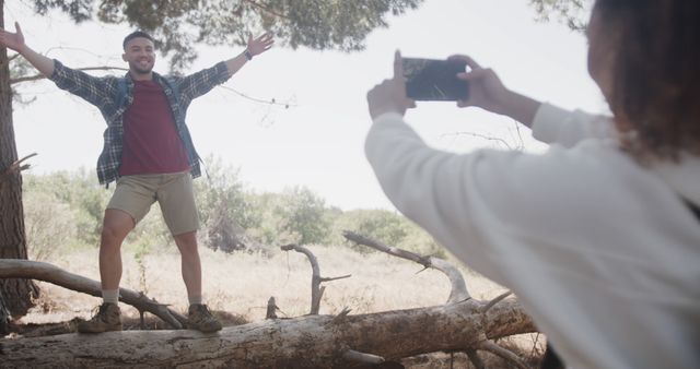 Happy Young Man Posing Outdoors for Photo During Hike with Friend - Download Free Stock Images Pikwizard.com