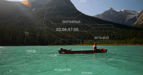 Couple Canoeing in Mountain Lake with Digital Overlay
