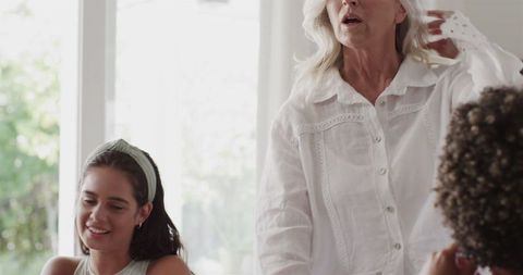 Joyful Elderly Woman at Wedding Celebration Indoors