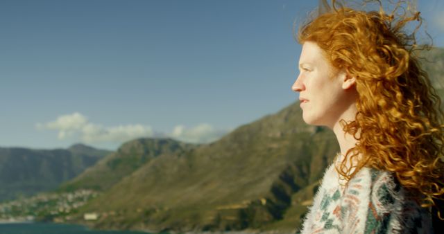 Woman with Red Hair Surveying Mountain Landscape in Tranquility - Download Free Stock Images Pikwizard.com