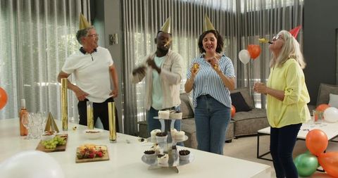 Diverse colleagues celebrating office party with joyful attitude