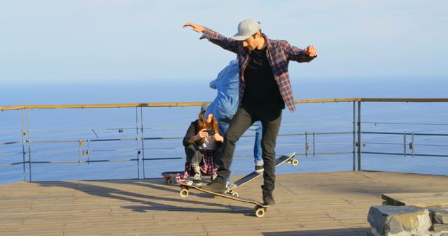 Teenagers Skateboarding by the Ocean - Download Free Stock Images Pikwizard.com