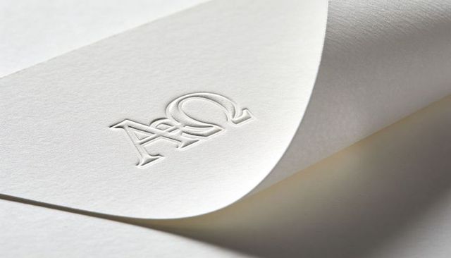 Embossed AO Monogram on Thick Cream Cardstock with Curled Corner and Soft Shadow