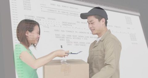 Courier delivering parcel while customer signing digital tablet with computer code overlay