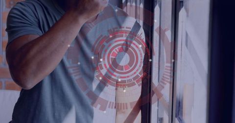 Person tasting homemade soup near rustic kitchen window