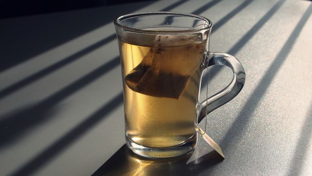 Glass Mug of Tea with Teabag in Cozy Light and Shadows - Download Free Stock Photos Pikwizard.com