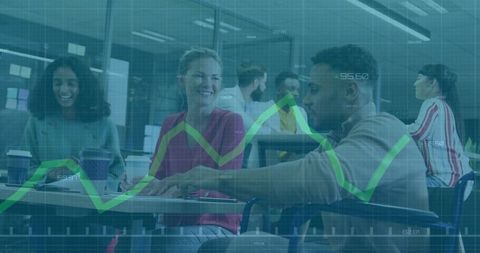 Diverse Team Analyzing Business Data in Open-Plan Office Setting