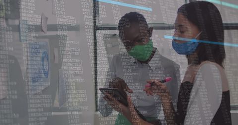 Diverse Businesswomen Analyzing Financial Data Amidst COVID-19