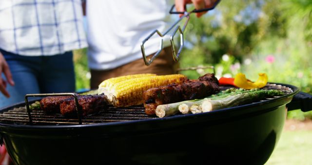 Perfect for websites and blogs related to summer activities, outdoor cooking, and BBQ recipes. Great visual for themes centered on family gatherings, backyard parties, and grilling techniques.