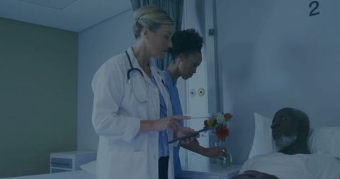 Doctor and Nurse attending to Hospital Patient in Clinical Room